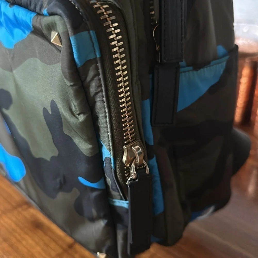 Valentino Garavani with COA nwot. Has hang tag and luggage tag. Unisex. Bookbag